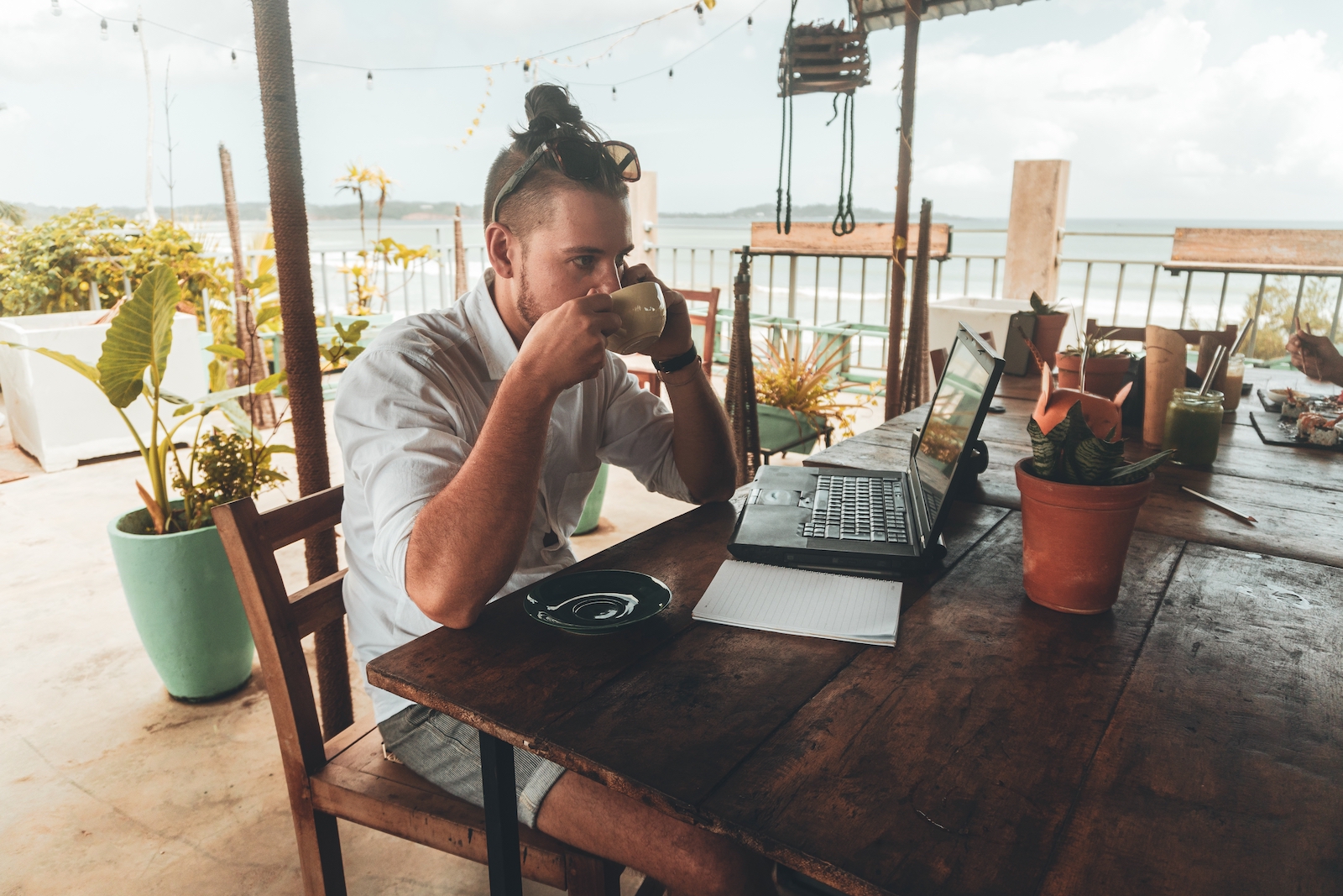 man on laptop with coffee